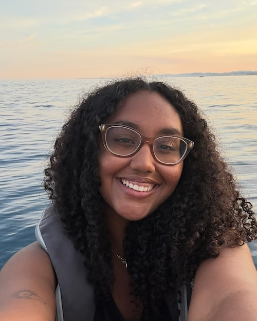 Photo of Khrista Nicholas in a boat on the open water