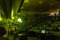 Former Chemistry faculty, Cathy Cahill, ignites gas filled balloon to make a green flame at the 2025 Science Potpourri event. 