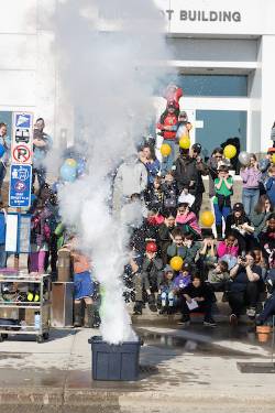 Science Potourri visitors crowd the Reichardt Building steps to see an exciting liquid nitrogen explosion.