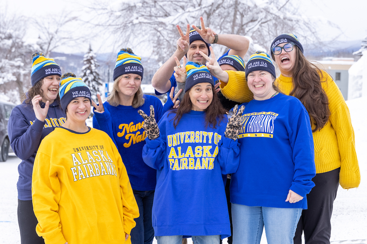 The CLA Dean team poses for a photo on a snowy day | UAF Photo by Eric Engman