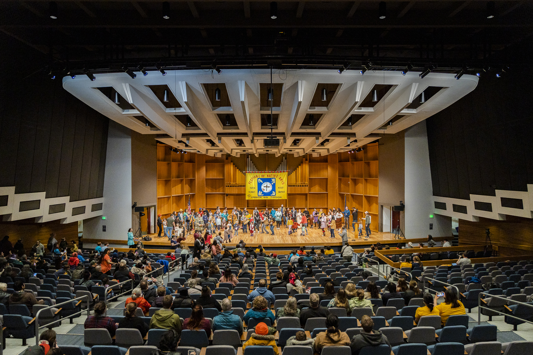 A wide view of the stage in the Davis Concert Hall as the UAF Troth Yeddha' Group performs | UAF Photo