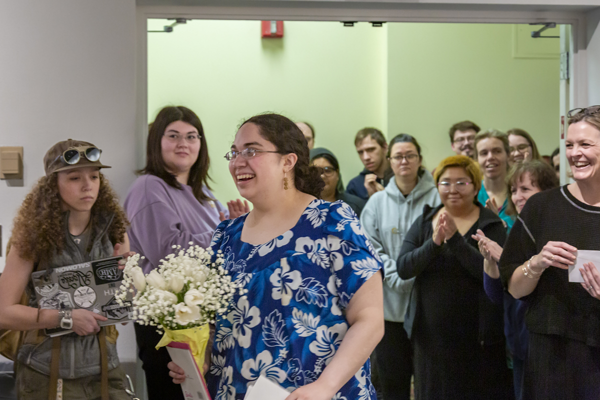Kainoa Ake received her first place award certificate. UAF Photo by Sarah Manriquez