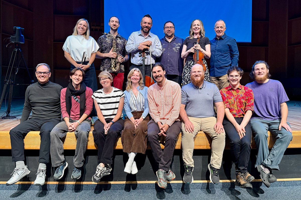 The full group—composers, program leader Stephen Lias (top right), and the ensemble CORVUS—gather after the final performance at Davis Concert Hall on Thursday, July 31, 2025. Photo courtesy of Knight