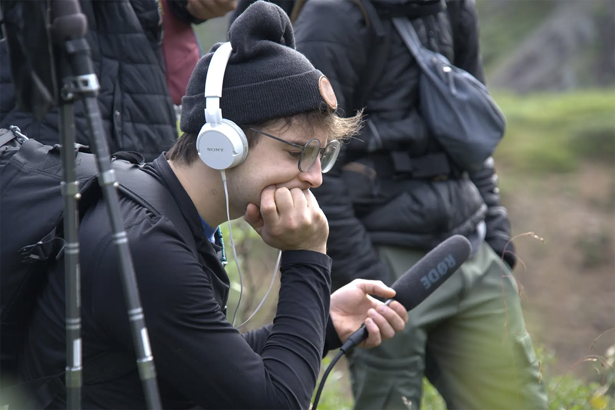 Close up of Seamus Knight recording with recording equipment in Denali. Photo courtesy of Knight
