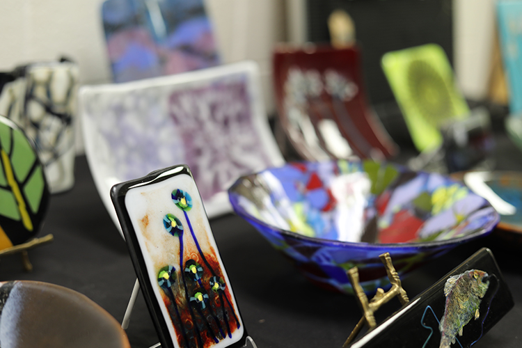 Fused glass pieces on display during the spring 2025 student art sale. Photo courtesy of Sarah Dexter