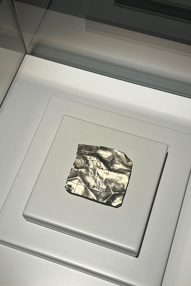 Nota, a silver clay contemporary jewel sculpted to resemble a worn handwritten note.