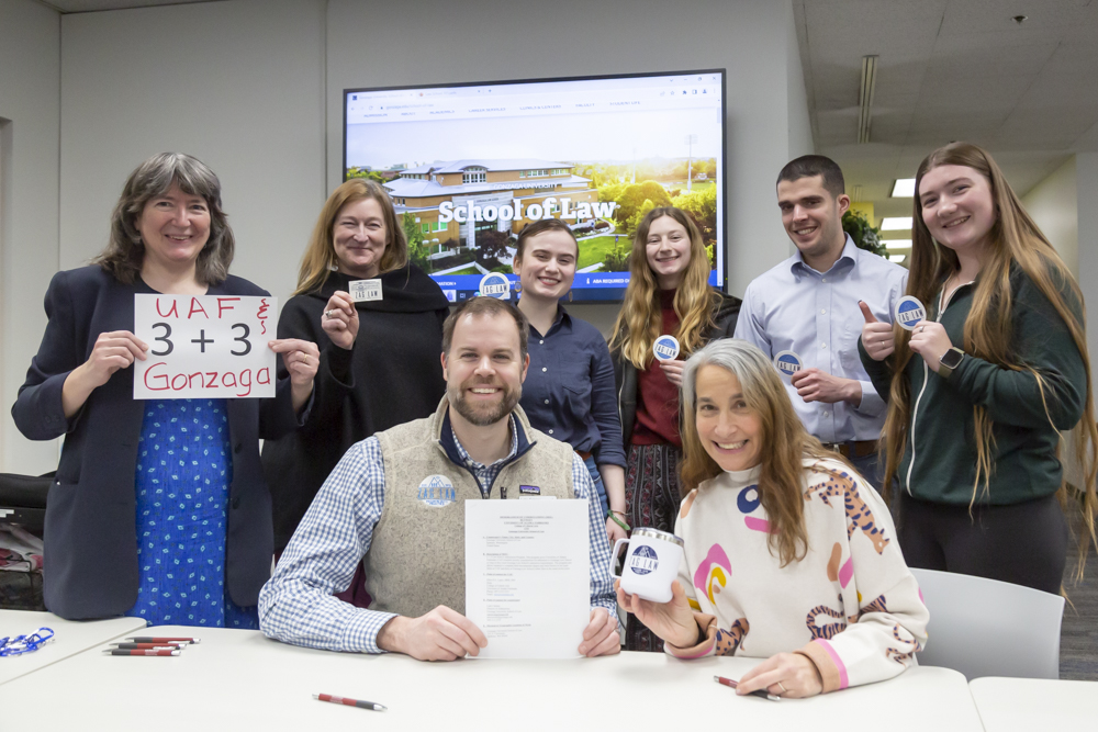 Pre-Law Club officers and members with Faculty Carol Gray, Dean Ellen Lopez pose at the signing ceremony for the MOU about the UAF / Gonzaga 3+3 program with Luke Cairney, the Director of Admissions from Gonzaga University School of Law. UAF Photo by Sarah Manriquez