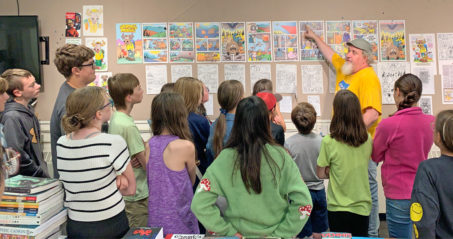 Jamie Smith displays Spruce Moose to a comic class during the 2024 Visual Art Academy. Photo courtesy of Jamie Smith