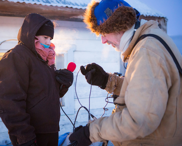 Brian O'Donoghue Monica Combs and journalism professor Brian O'Donoghue prepare to interview mushers from the 2014 Yukon Quest at the Mile 101 checkpoint. UAF Photo by JR Ancheta