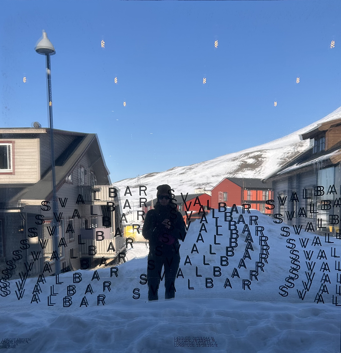 Katie Ione Craney in front of a reflective window in Svalbard. Photo courtesy of Craney