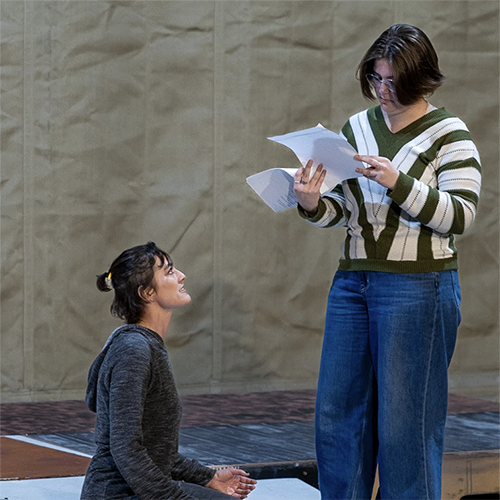 Actors Emily Yates (left) and Kaylee Cole (right) rehearse a romantic moment. Photo credit: Kade Mendelowitz