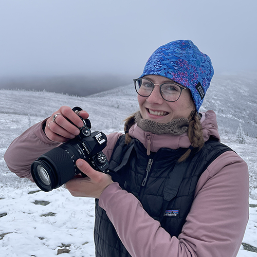 Lizzy Hahn poses with her camera. Photo by Gwen Lockwood.