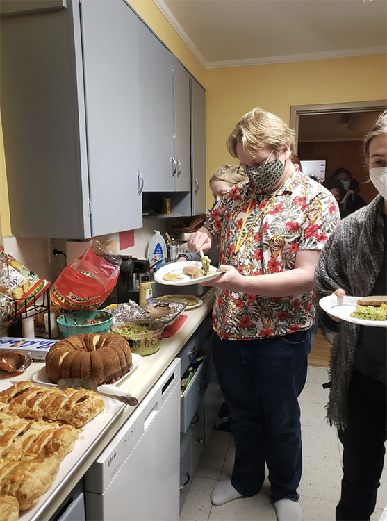 Students line up in the kitchen of the Honors House for traditional German food. Photo courtesy of Helga Wagenleiter