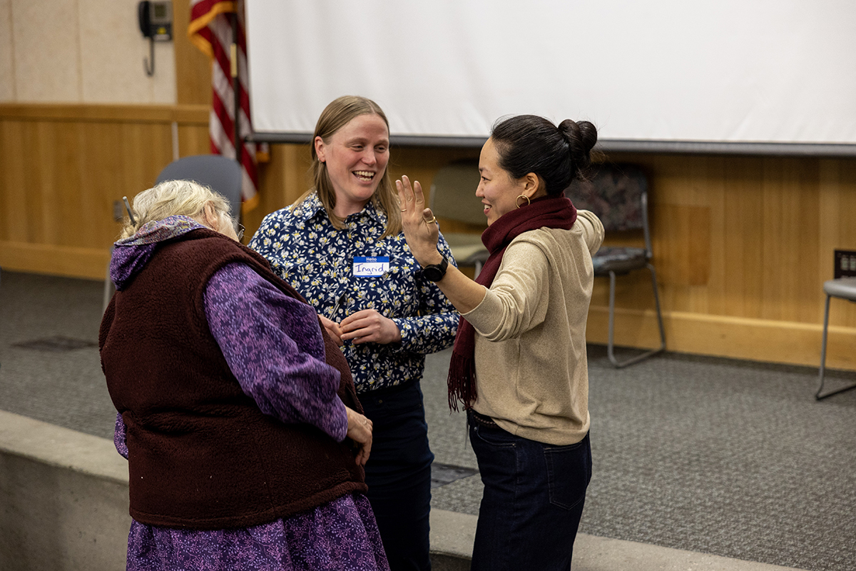 Rei Shimizu (right) and Ingrid Johnson (center) speak with a community elder during the 2025 Restorative Justice Symposium at the University of Alaska Anchorage. Photo courtesy of Johnson and Shimizu