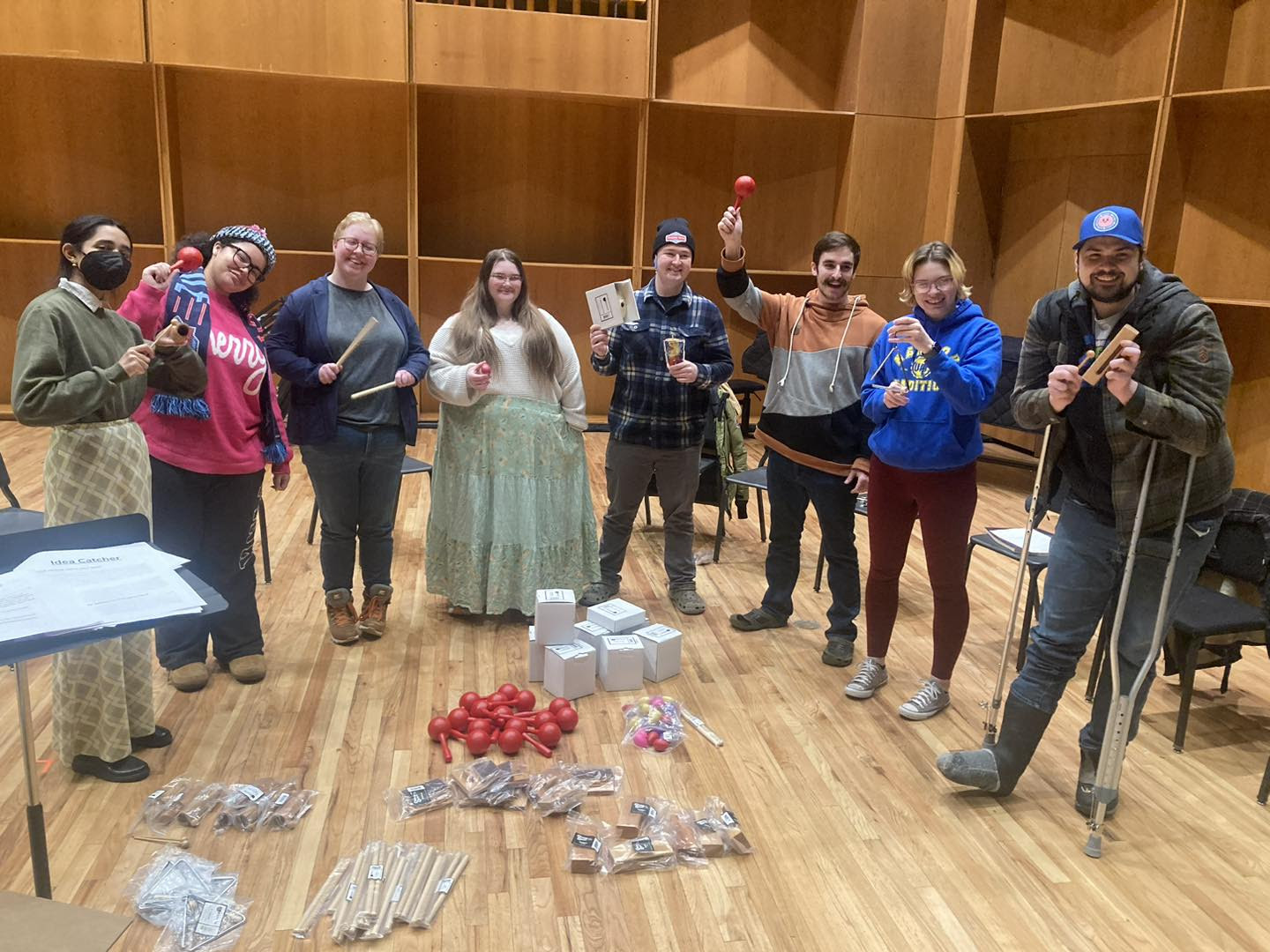 Beatrice Turley and students holding percussion instruments