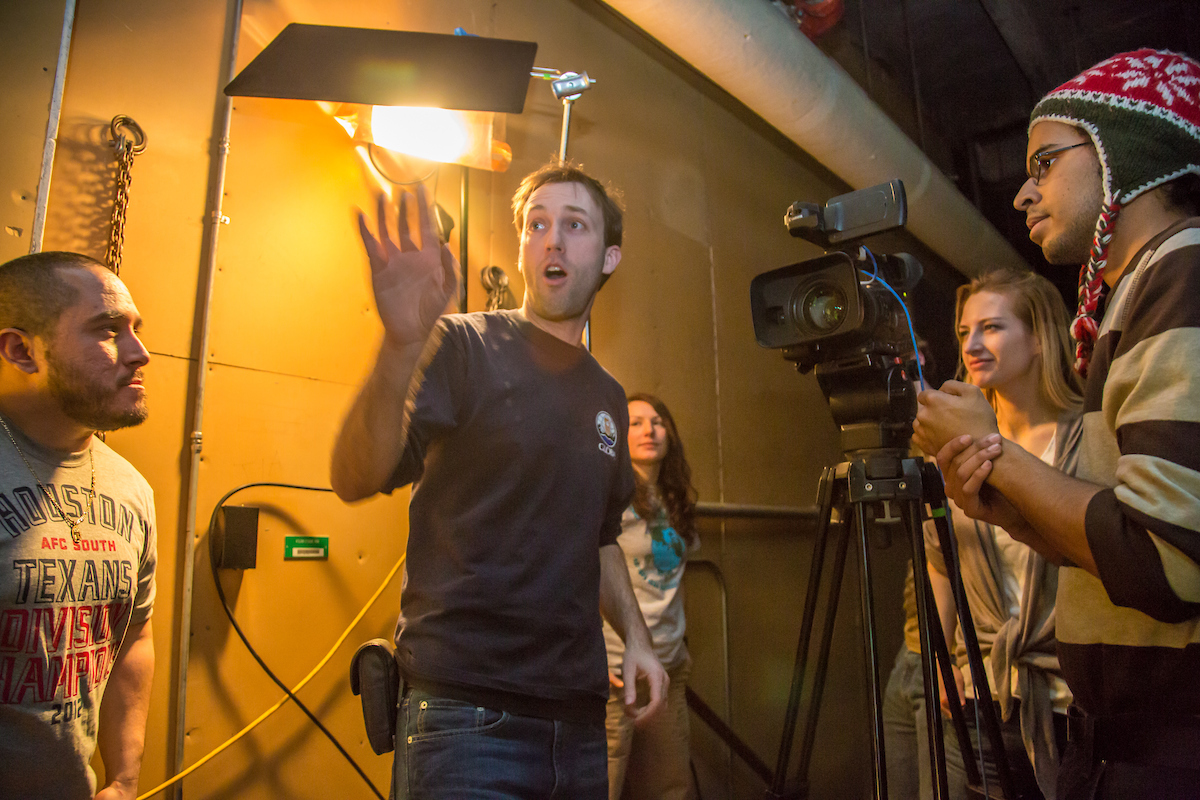 Students in visiting lecturer Dave Selle's 2012 Wintermester cinematography class listen to comments before shooting a scene in the UAF Fine Arts complex. | UAF Photo by Todd Paris
