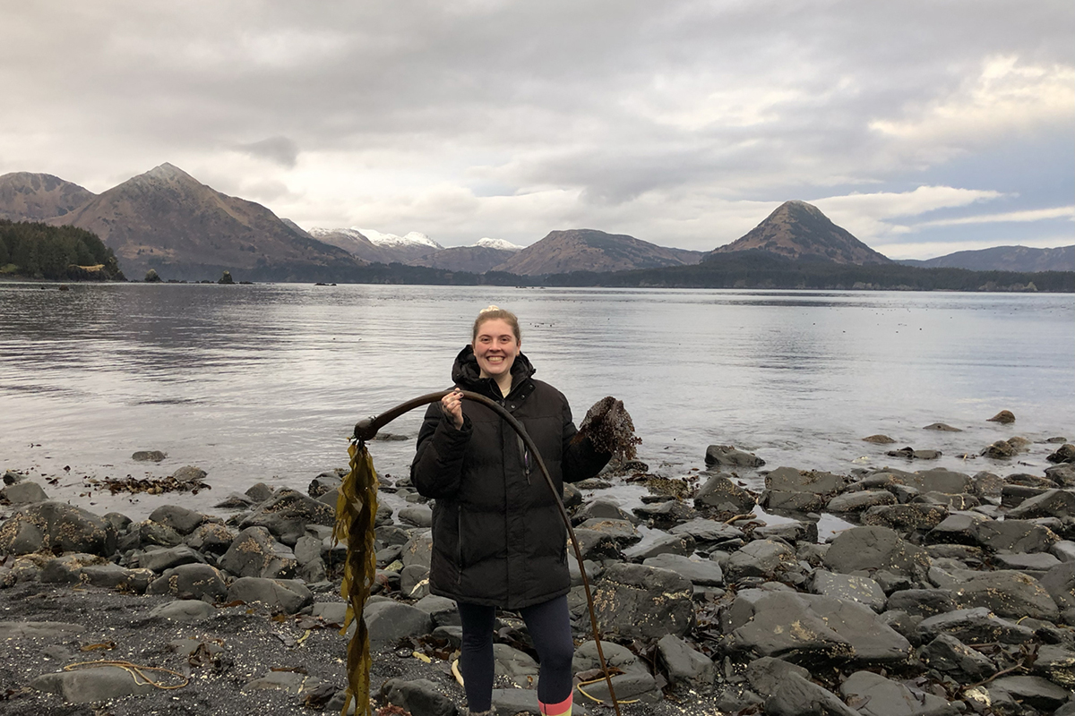 Tori McDermott poses with bull kelp. Photo courtesy of Tori McDermott