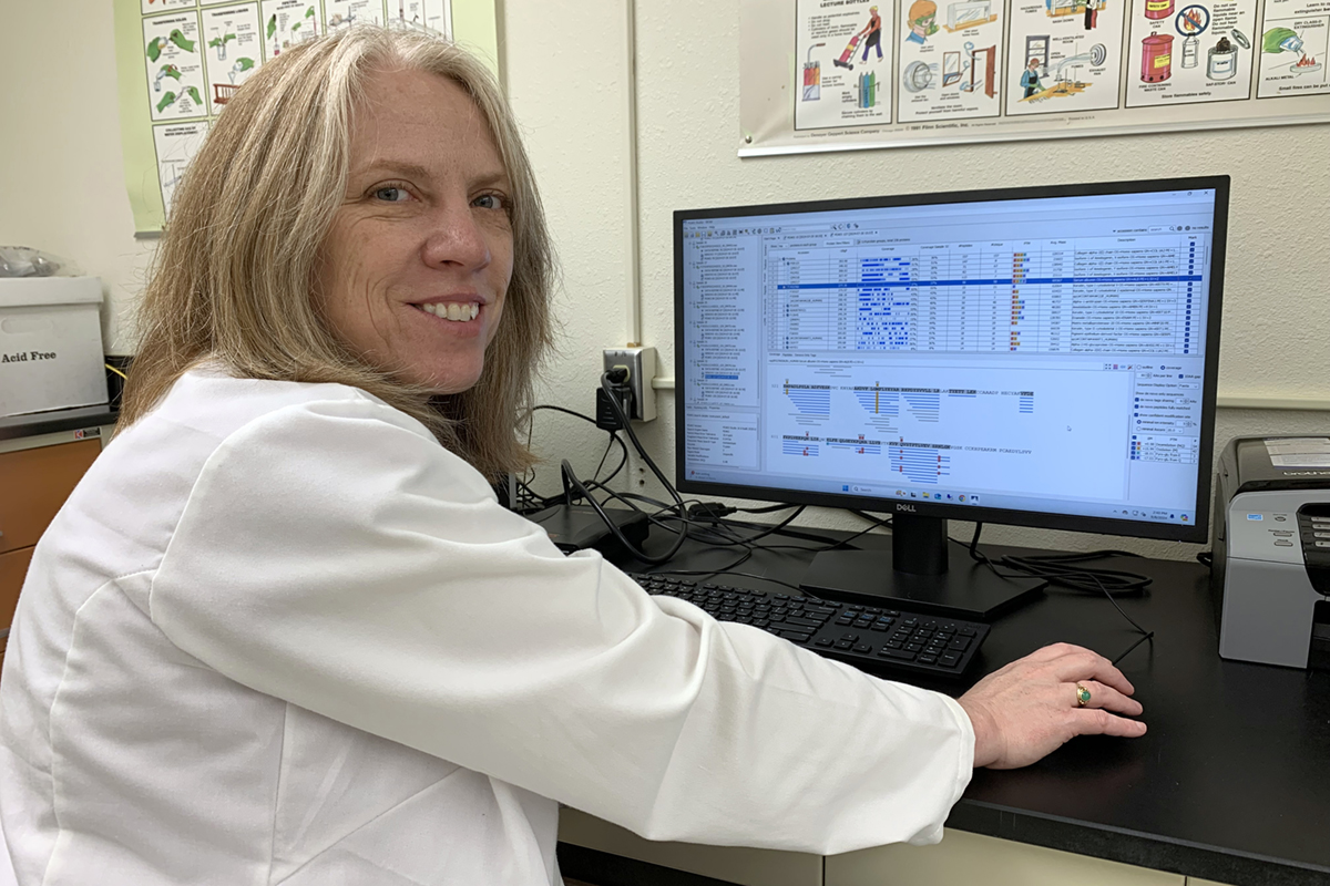 Photo courtesy of Tammy Buonasera Tammy Buonasera, assistant professor at the University of Alaska Fairbanks, looks at test results from her study of proteins in tooth enamel.