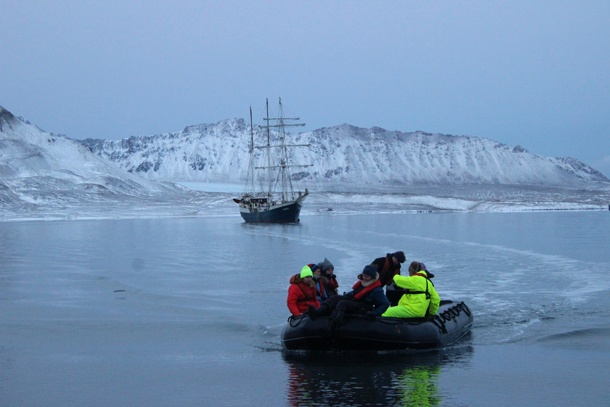 The group of artists aboard the Antigua raft to shore in Svalbard. Photo courtesy of Daryl Farmer