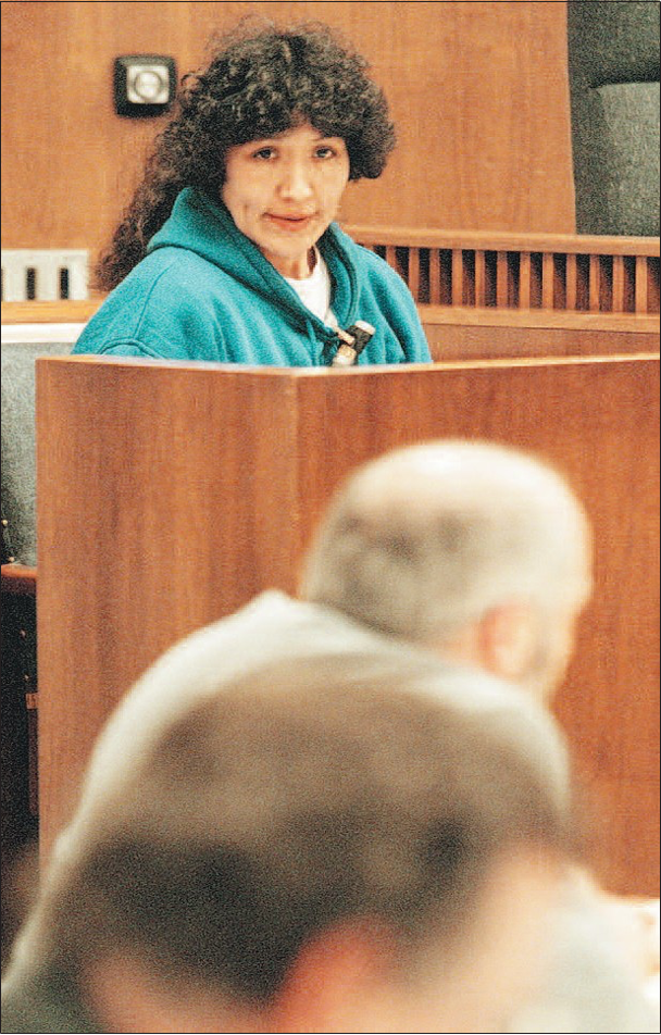 Ida McClough, top, listens to Assistant District Attorney Jeff O’Bryant as he addresses Alaska Superior Court Judge Sigurd Murphy in the February 1998 hearing. McClough is the mother of Eugene Vent, one of four men found guilty of murdering John Hartman.