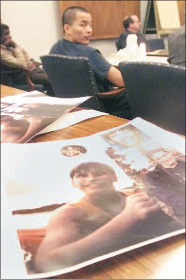 Friends and family of 15-year-old John Hartman brought in photos of the teen during a pre-sentencing hearing for George Frese, in back, in January 2000.