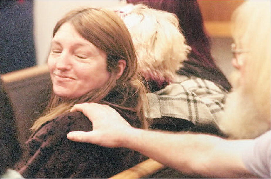 John Hartman’s mother, Evalyn Thomas, gets comfort from friend Dave Fink after George Frese’s sentence was read in January 2000. Frese was one of four men convicted in the 1997 murder of Hartman.