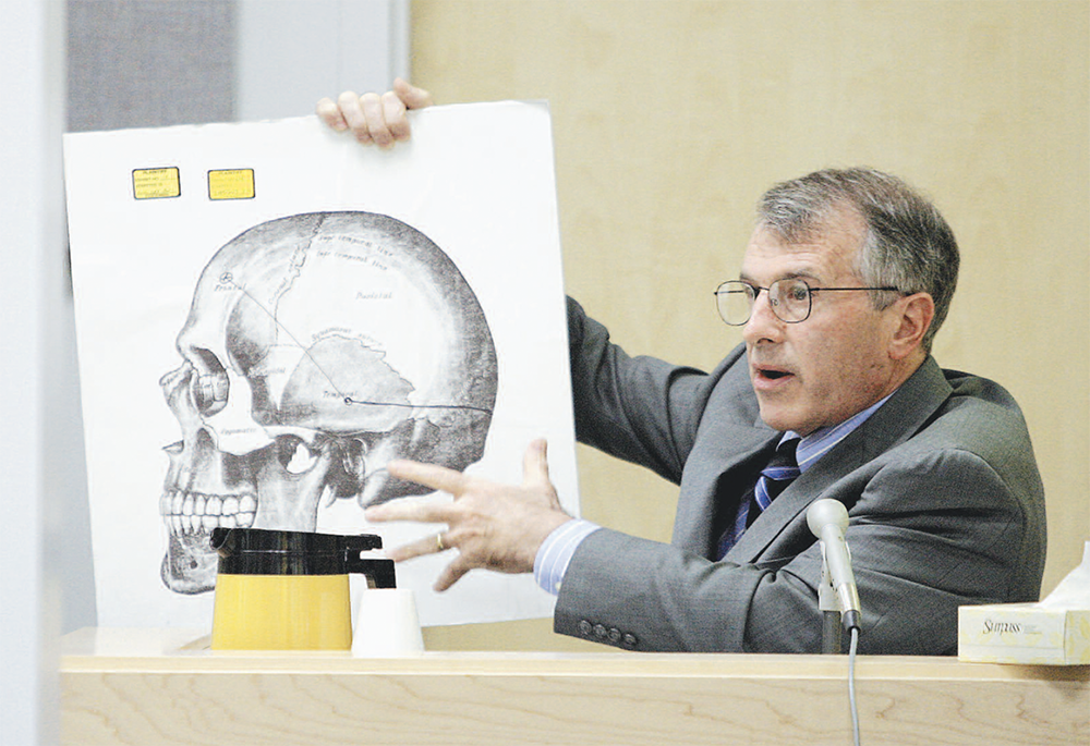 The late Franc Fallico, Alaska’s former chief medical examiner, seen here testifying in 2003 at an unrelated Nome proceeding, changed his opinion on the eve of his scheduled appearance on the witness stand during the first Hartman trial in 1999. After viewing the exhibit assembled outside the state crime lab by Fairbanks lawmen, the pathologist for the first time detected similarity between the victim’s bruises and a boot seized from murder suspect George Frese. 