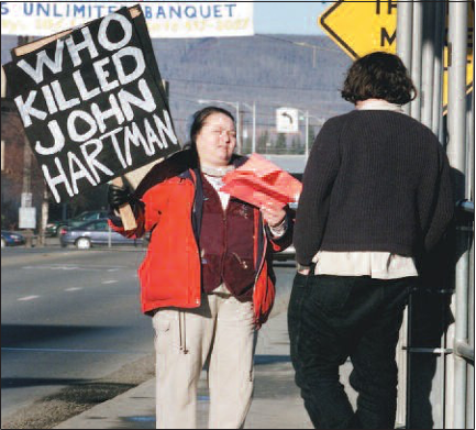 The late Carol Pease, shown here handing out protest fliers in 1999, blamed herself when suspicion fell upon her son, Kevin.