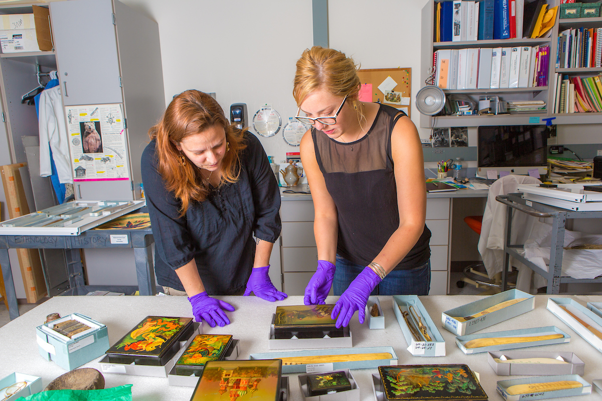 Angela Linn, left, ethnology and history collections manager at the University of Alaska Museum of the North, catalogs donated Russian artifacts with student assistant Kirsten Olson in a museum lab.. UAF Photo by Todd Paris