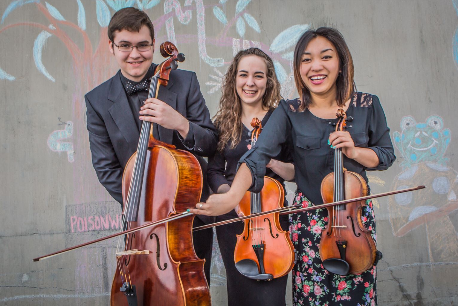 UAF music majors Sean Braendel, left, Annalisa Taylor, center, and Rose Crelli goof around with their instruments outside the Fine Arts complex on a March afternoon.