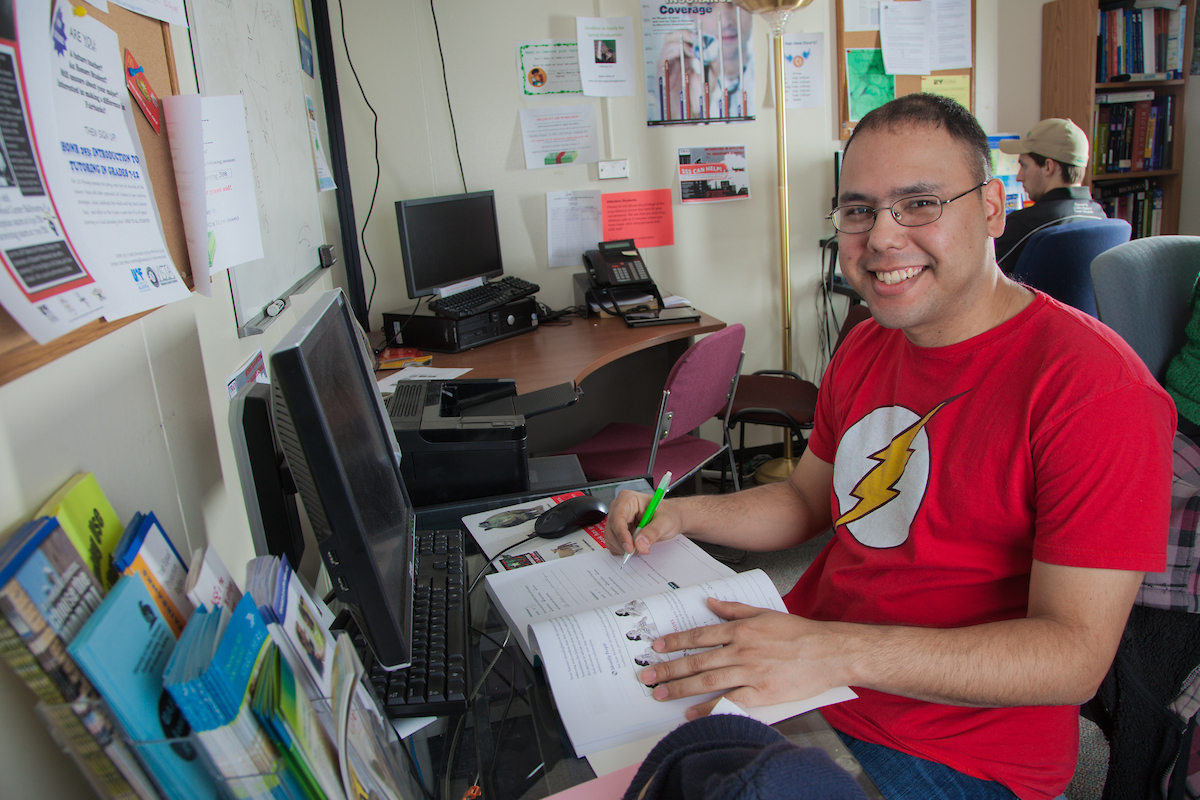 Sociology major Henry Tang works on his American Sign Language homework in the Student Support Services study lounge between classes. UAF Photo by Todd Paris