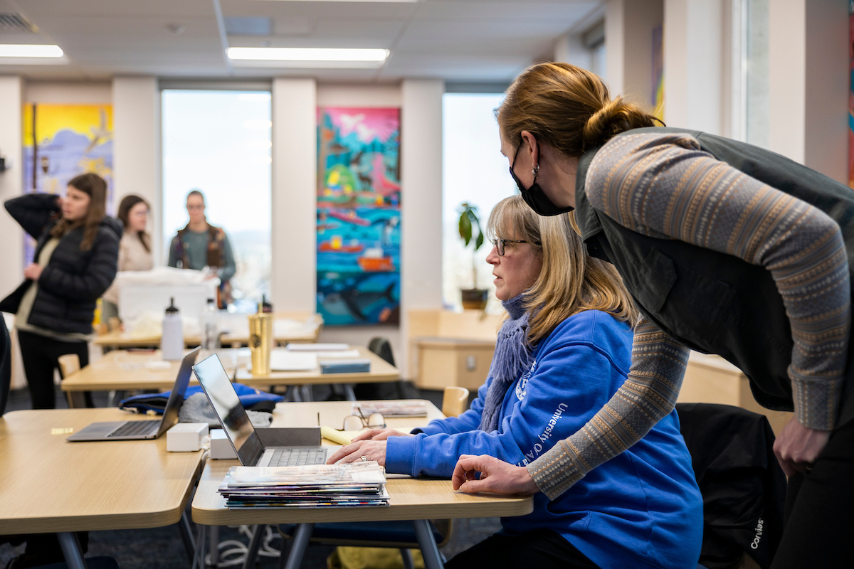 Students of the School of Education participate in a hands-on group work lesson in their new classroom space on the 7th floor of the Gruening Building, 2/15/23. (UAF Photo by Leif Van Cise)
