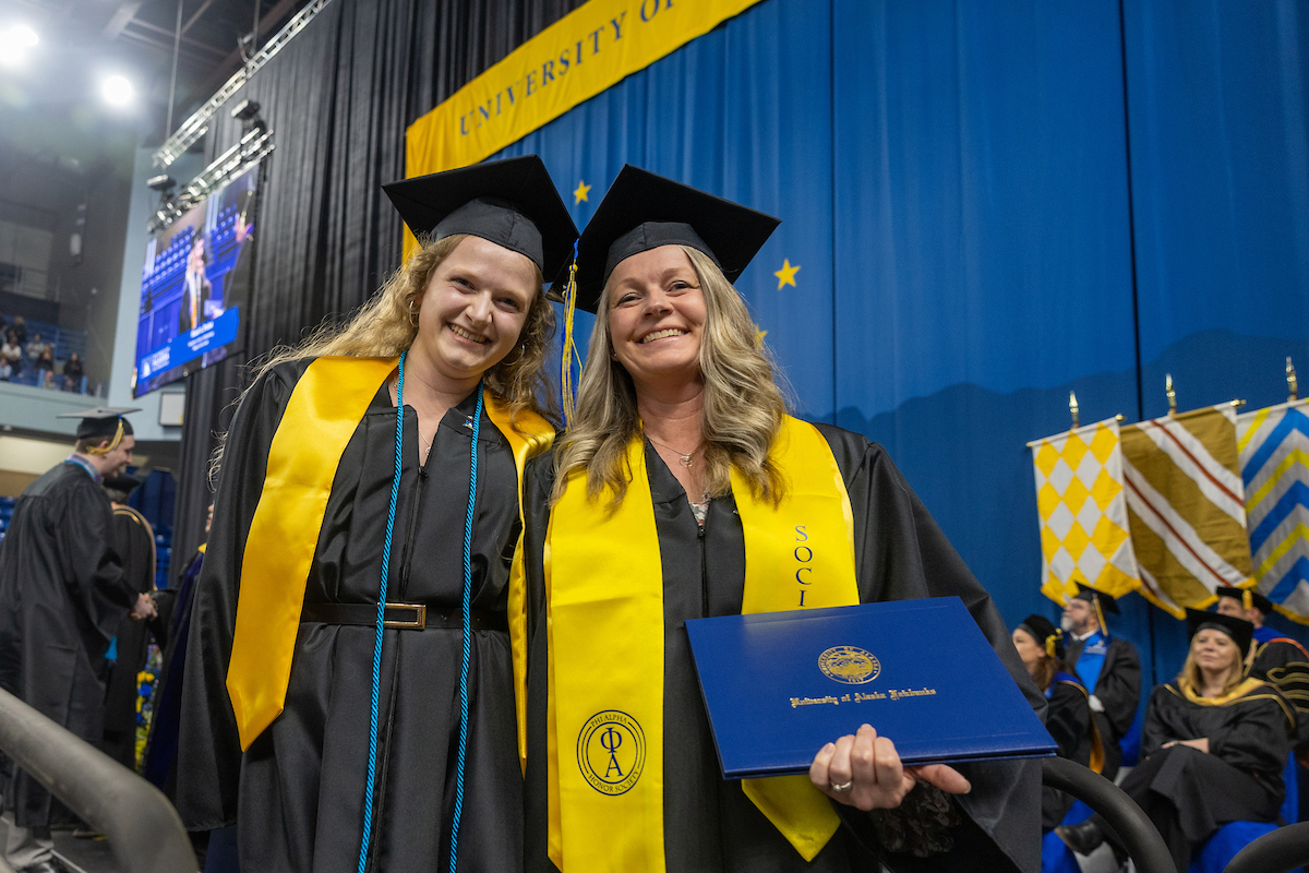 Graduates pose during the 2025 University of Alaska Fairbanks Commencement Ceremony Saturday, May 3, 2025 at the Carlson Center. UAF Photo by Eric Engman