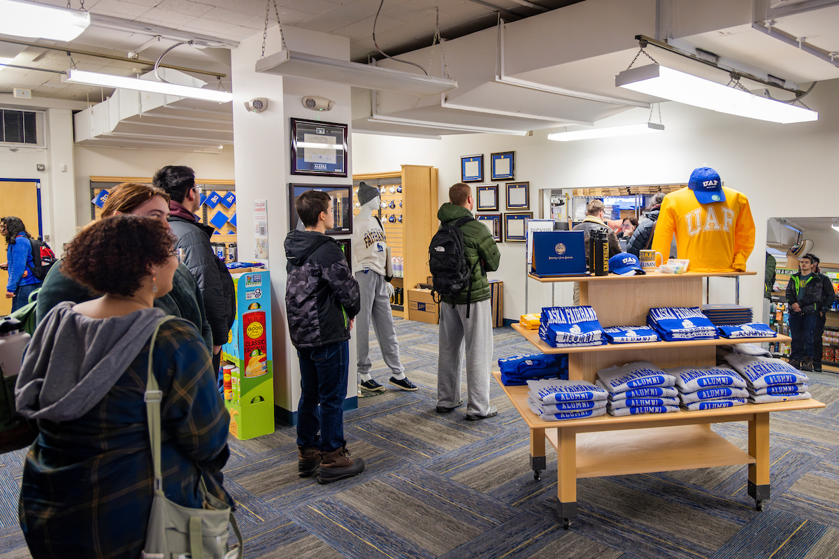 Nanook Nation returns as the first day of the 2025 spring semester kicks off across the Troth Yeddha' Campus. Students line up for their textbooks and class materials at the Campus Bookstore. Monday, Jan. 13, 2025.  (UAF photo by Leif Van Cise)