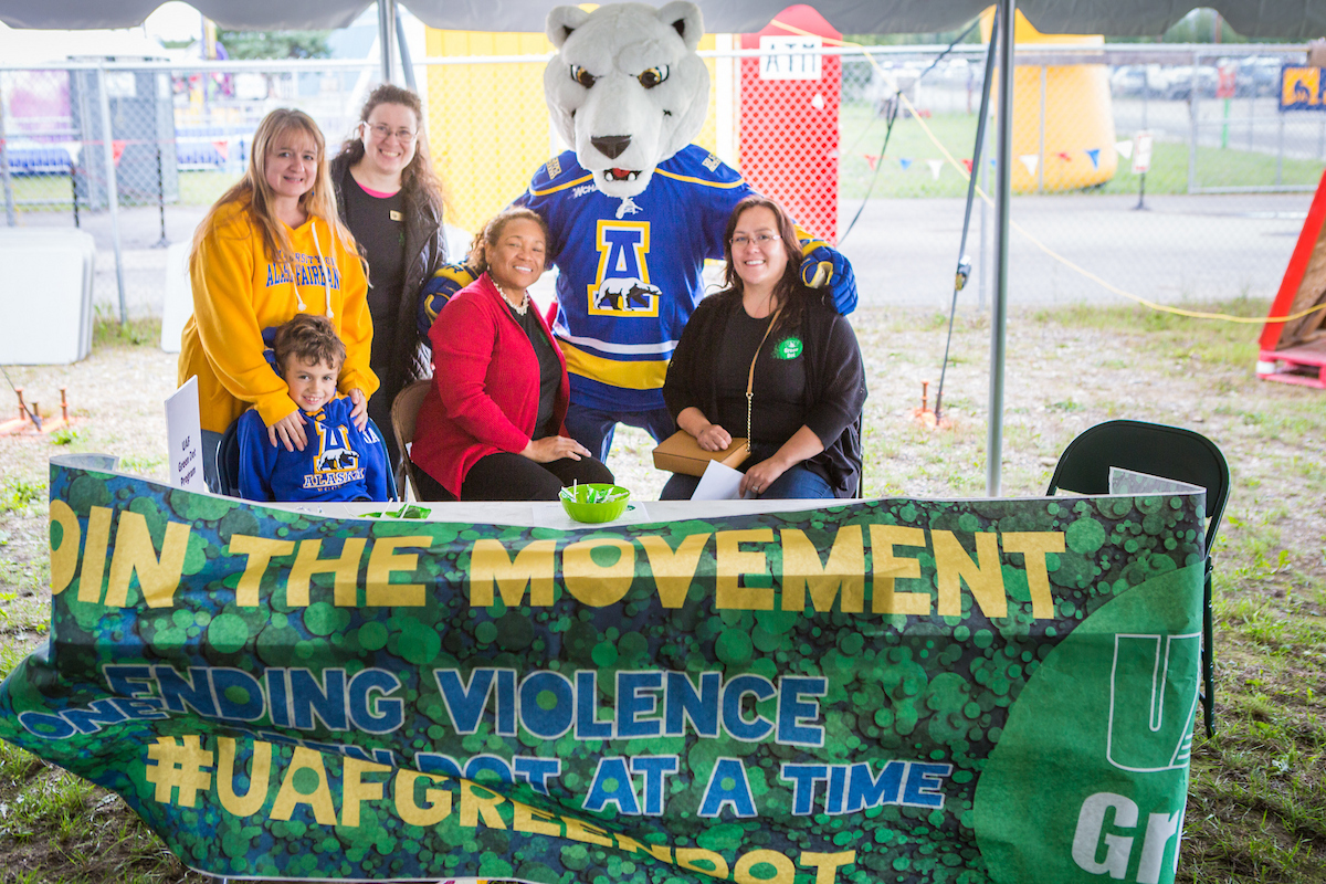 The Nook poses for a portrait with the UAF Green Dot booth at the Tanana Valley State Fair during UAF Day. UAF Photo by JR Ancheta