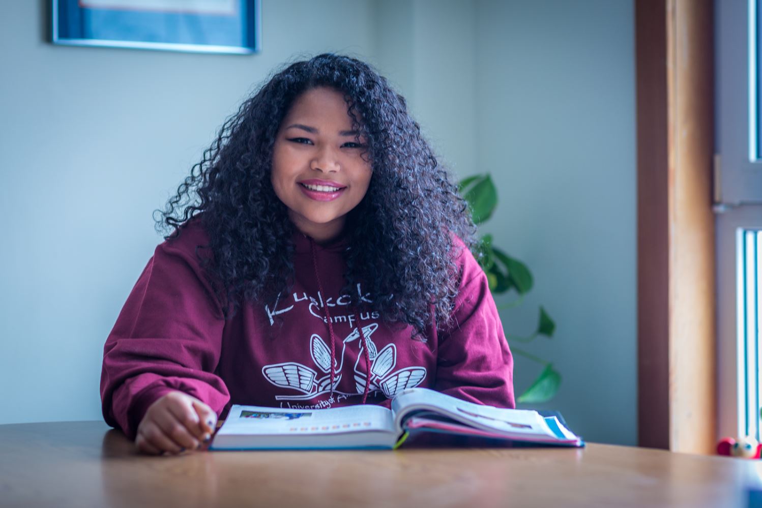 Kisha Lee, majoring in rural human services at UAF's Kuskoskim Campus in Bethel, studies in the student lounge on campus.