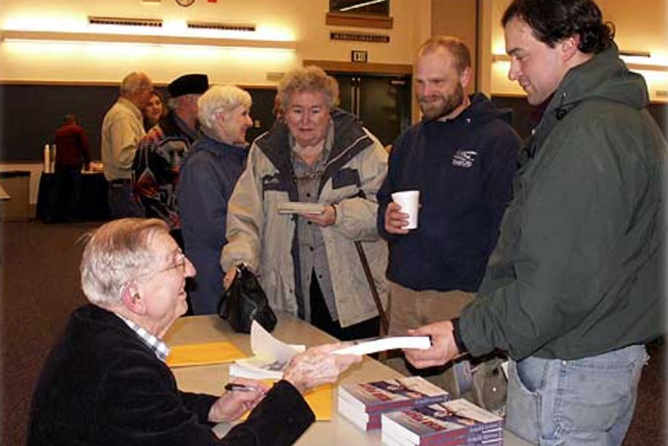 Alaskan author, Arnold Griese, Tim Bercher pilot with Taquan Air,, Josh Murdock pilot with Pacific Airways, and Irene Nichols (Grandmother of pilot Carl Zink with Taquan.) Photo by Marie L. Monyak