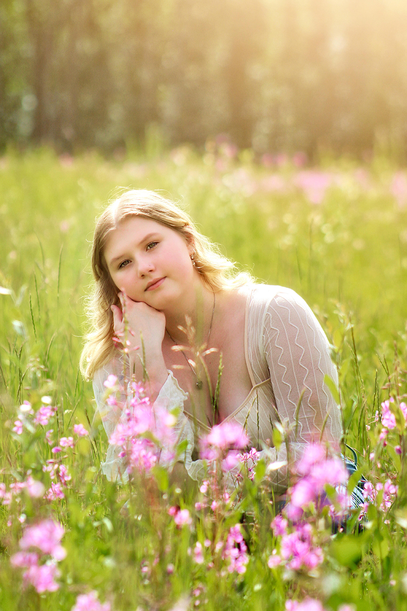 Nikkia Jordan in a field of flowers. Photo credit: Emily Bevard
