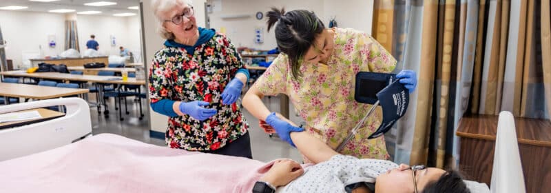 Two nurses practice nursing practices