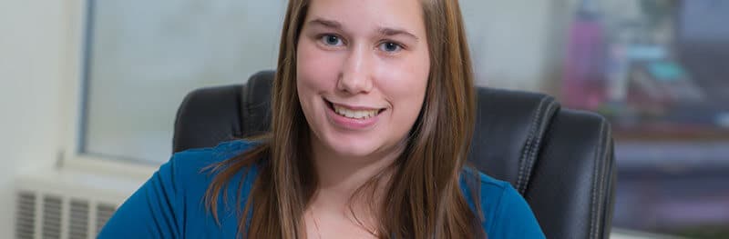 Student smiling at the camera