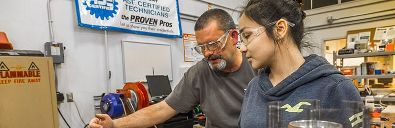 Student and instructor working in automotive shop