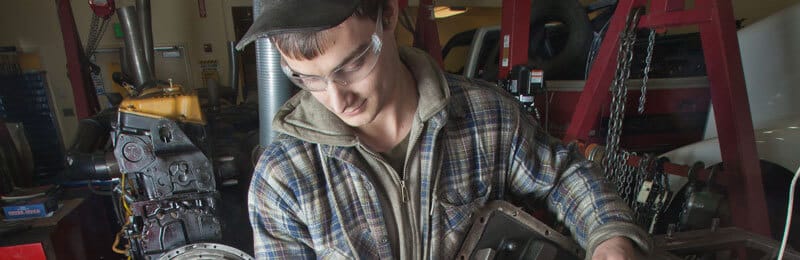 student working with machinery