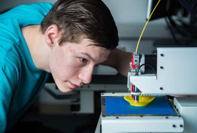 Stephen Ramirez keeps an eye on the progress of his project during an open work session at UAF Community and Technical College’s 3-D print lab in downtown Fairbanks.