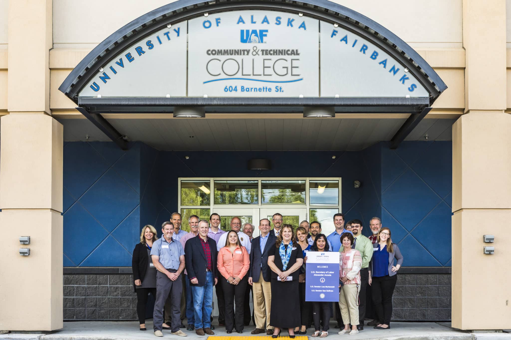 U.S. Secretary of Labor, Alexander Acosta and U.S. Senator, Dan Sullivan pose for a photo with UAF Community & Technical College students, staff, faculty, and community partners in front of CTC's downtown center.