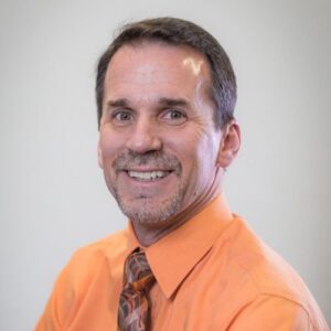 A headshot of Tim Stickel
