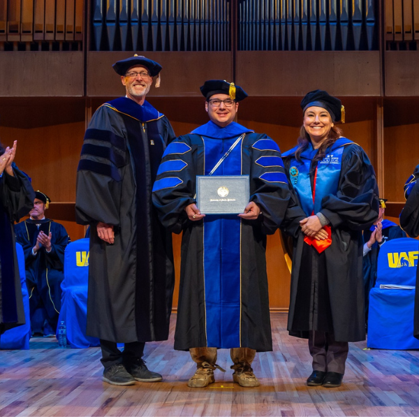 PhD recipient Joel Isaak at hooding ceremony