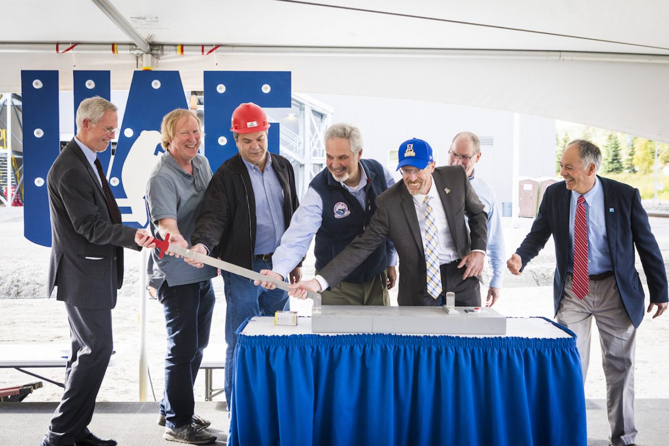 University employees and supporters prepare to throw a ceremonial switch celebrating completion of the Combined Heat and Power Plant on Wednesday, Aug. 29, 2018. Pictured are UA President Jim Johnsen; Chilkoot Ward, from Facilities Services; Joe Usibelli Jr., president of Usibelli Coal Mine; state Sen. Pete Kelly; Chancellor Dan White; Doug Smith, from contractor Haskell Davis; and Mike Ruckhaus, of Facilities Services. UAF photo by JR Ancheta..
