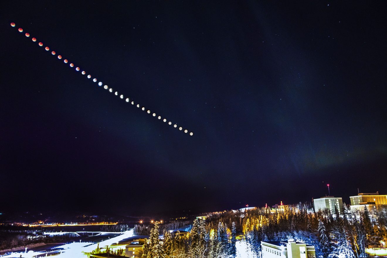 This is a composite image of the super blue blood moon over the Fairbanks campus as seen from the roof of the Gruening Building.