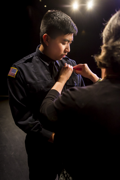 Jeremy Tapaoan receives his badge during the pinning ceremony at the Community and Technical College police academy graduation Friday, Oct. 12, 2018.
