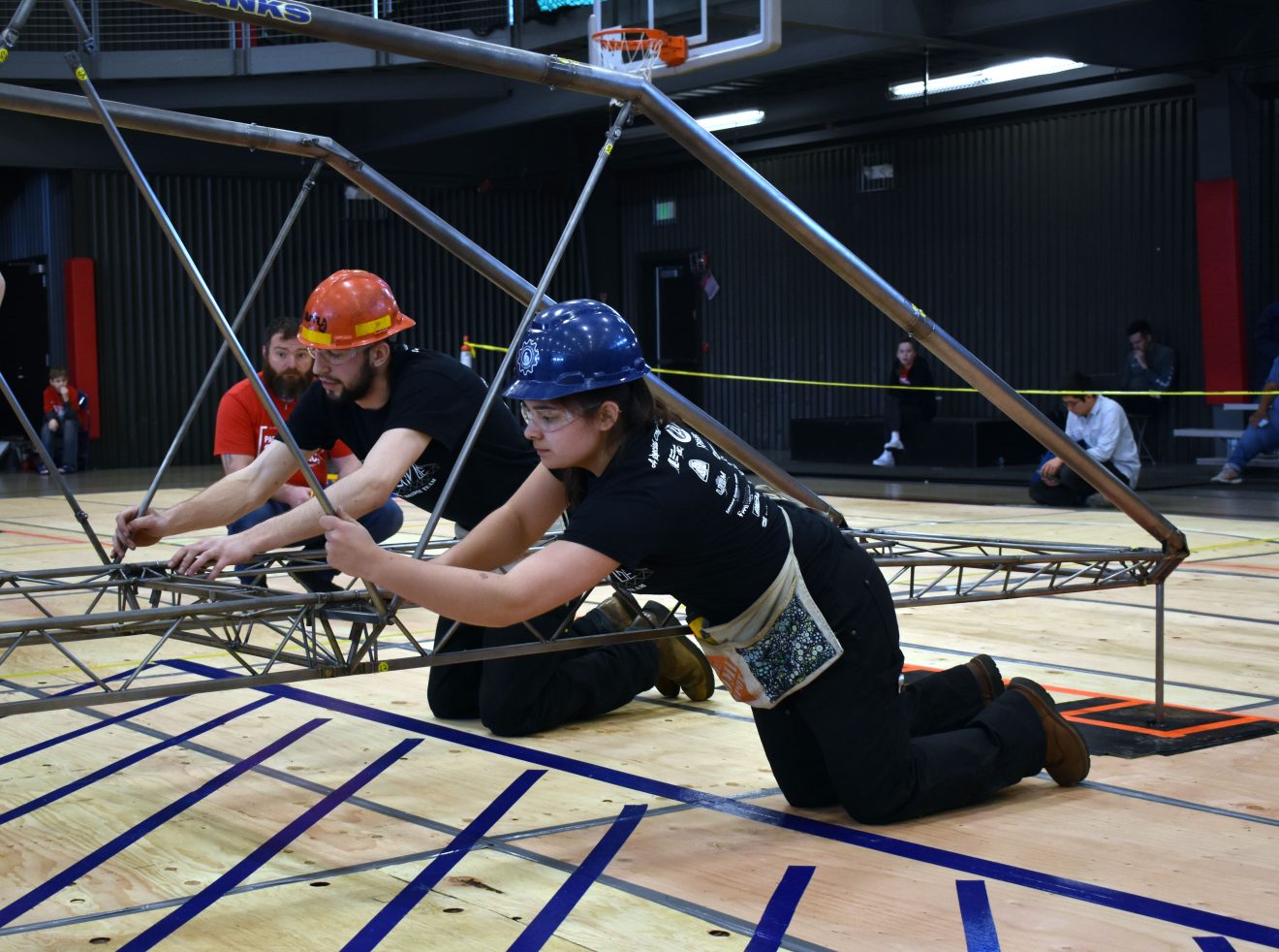 UAF Steel Bridge Team members Larry Hiles, left, and Juliana Rivera help construct the team's winning entry at the regional competition in Lacey, Washington. Photo courtesy of Taylor Tharp